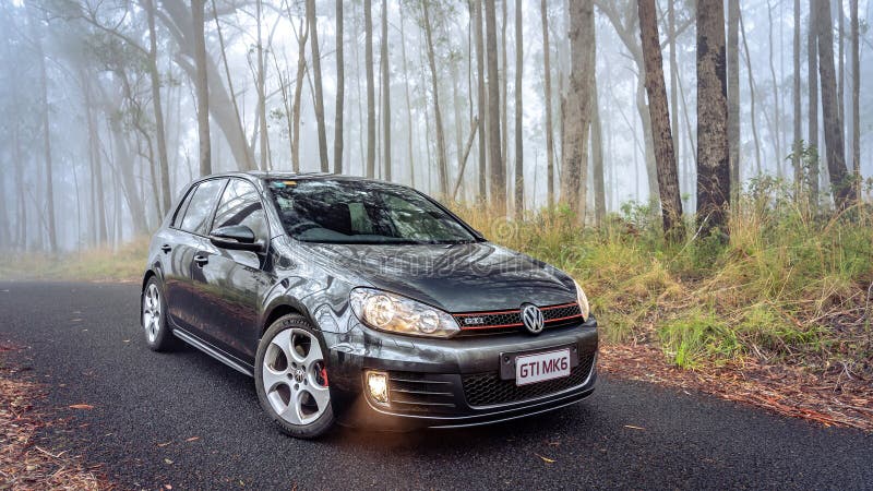 New South Whales, Australia - Volkswagen Golf GTI MKVI parked in a foggy forest.