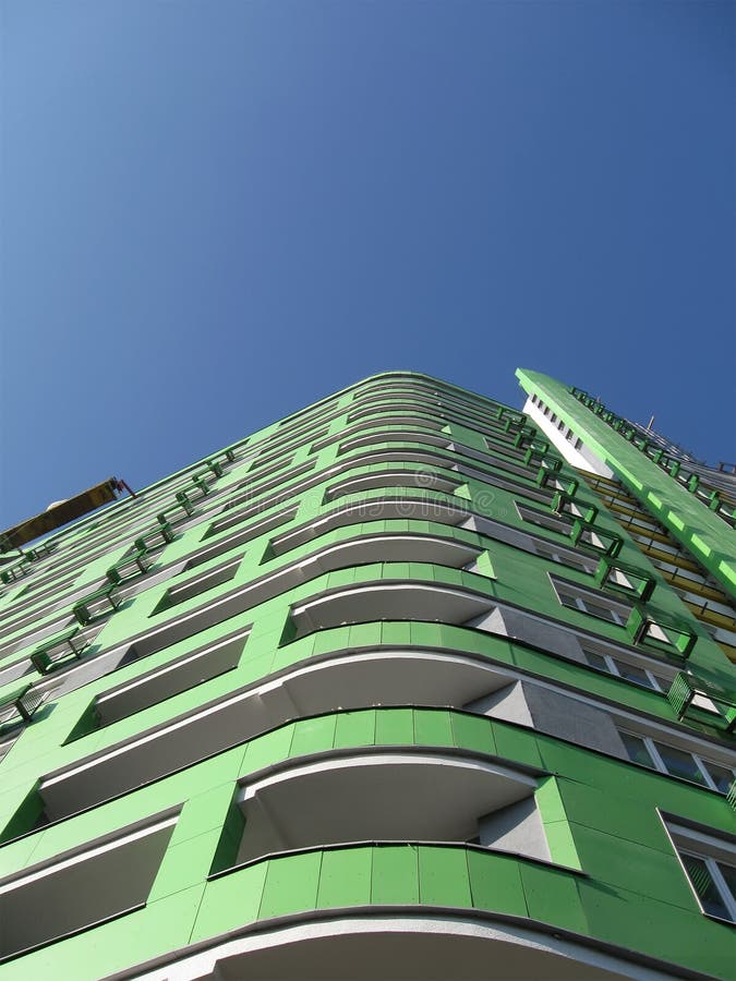 New urban high building, green color, blue sky