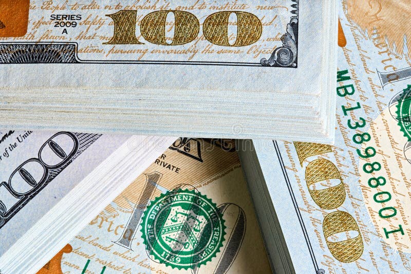 New US Dollar USD 2009 series bill bundles background for design. Many bundle of US 100 dollars bank notes. royalty free stock images