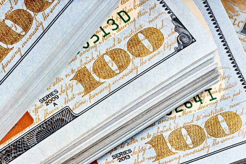 New US Dollar USD 2009 series bill bundles background for design. Many bundle of US 100 dollars bank notes. stock photo