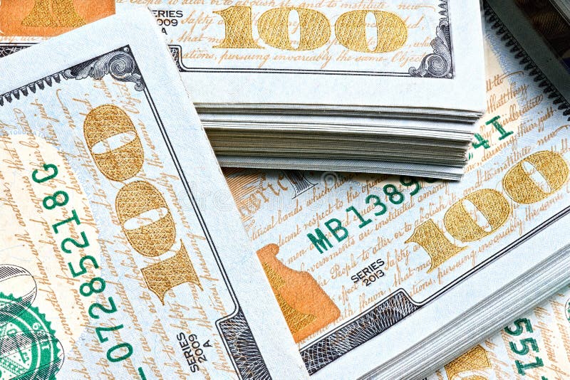 New US Dollar USD 2009 series bill bundles background for design. Many bundle of US 100 dollars bank notes. stock photography