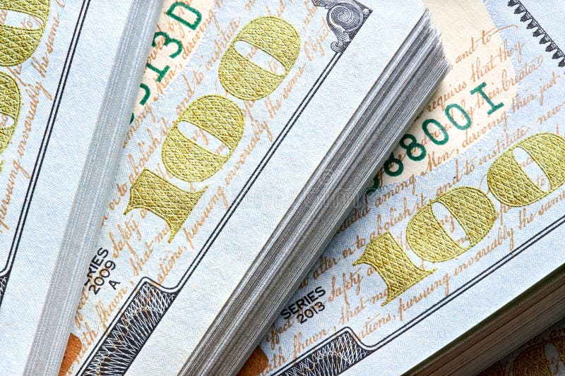 New US Dollar USD 2009 series bill bundles background for design. Many bundle of US 100 dollars bank notes. royalty free stock photo