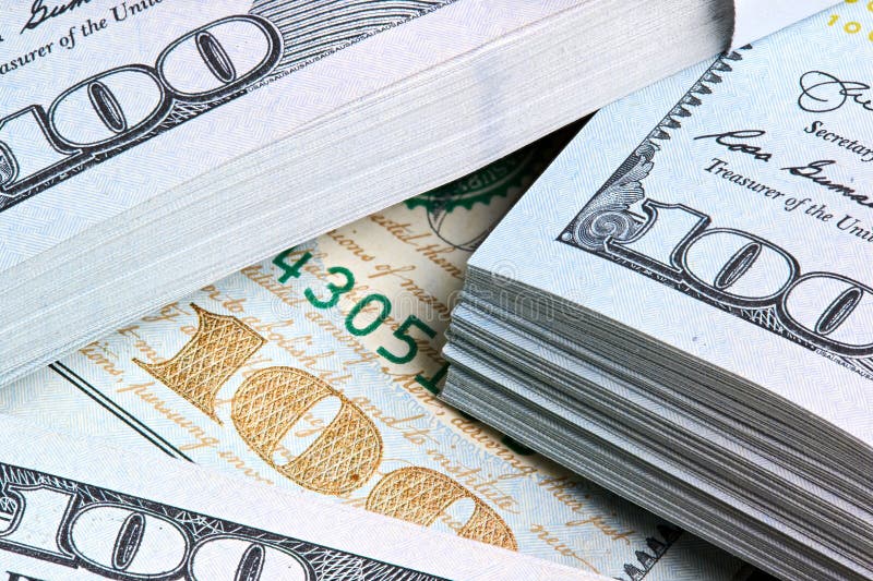 New US Dollar USD 2009 series bill bundles background for design. Many bundle of US 100 dollars bank notes. royalty free stock image