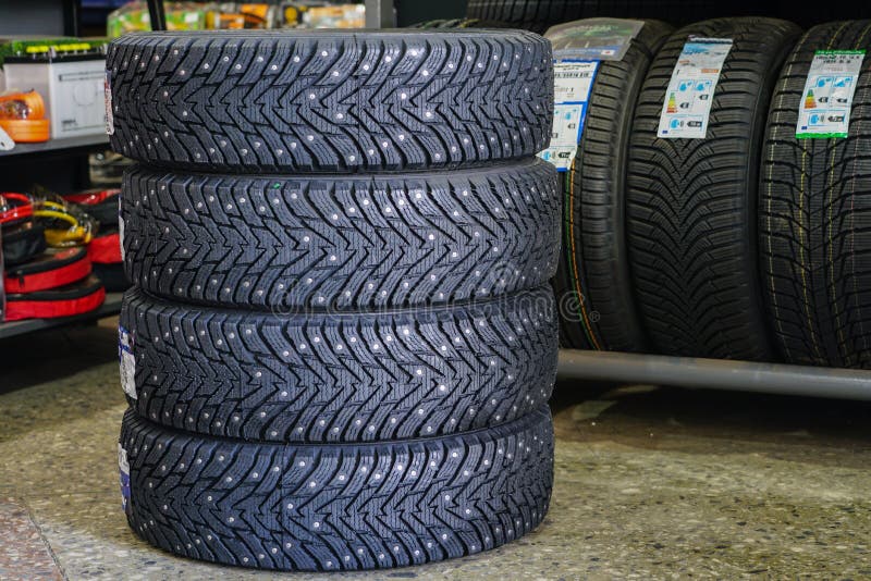 New Winter Tire Set with Studs at Tire Shop Stock Photo Image of tire
