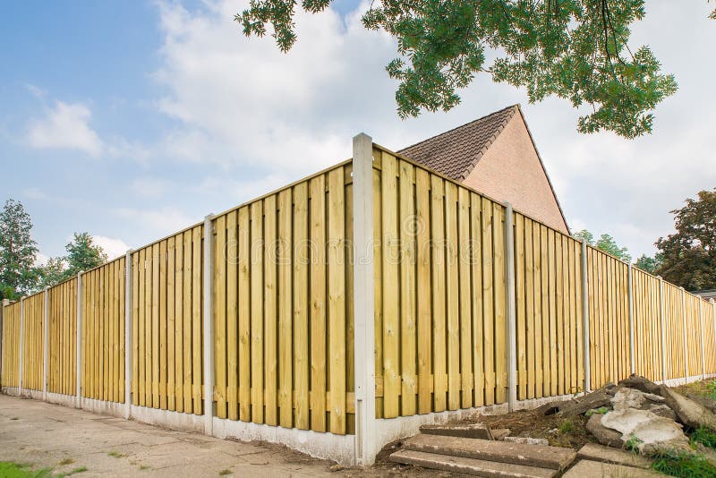 New wooden fence at garden of house