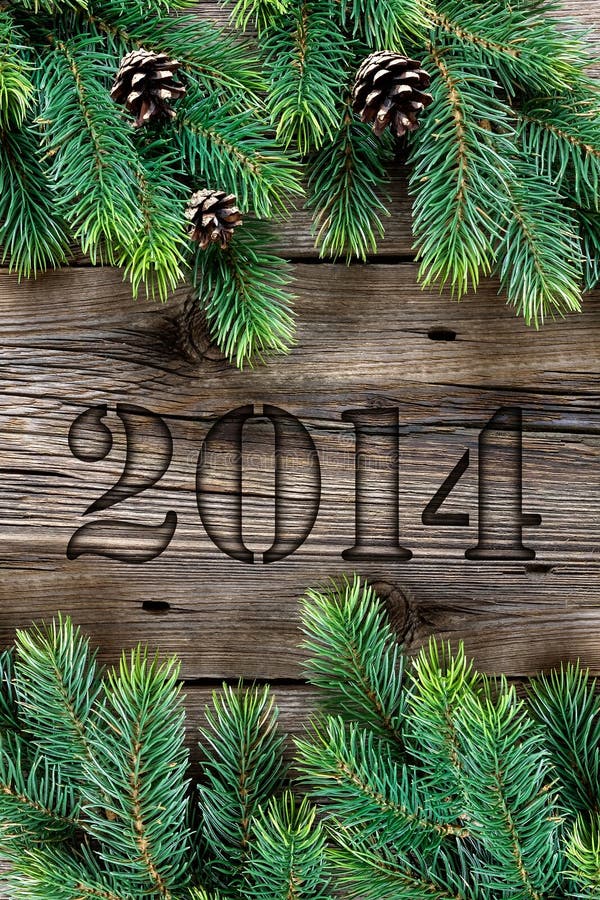 New year 2014. New Year Card 2014 on wooden background royalty free stock image