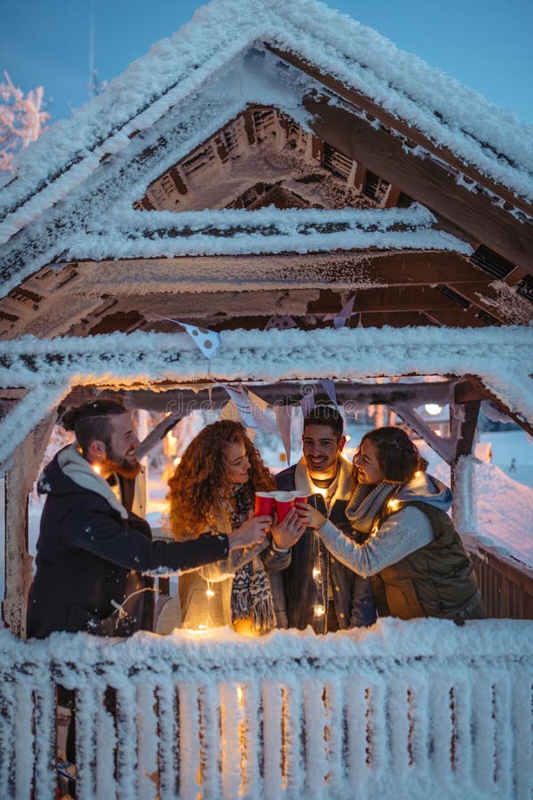 New Year celebration with friends in mountain cabin. stock images