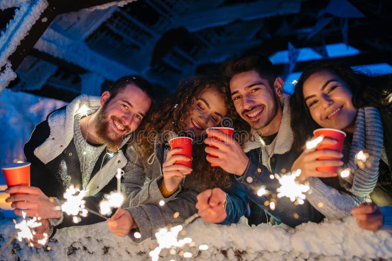 New Year celebration with friends in mountain cabin. stock photography