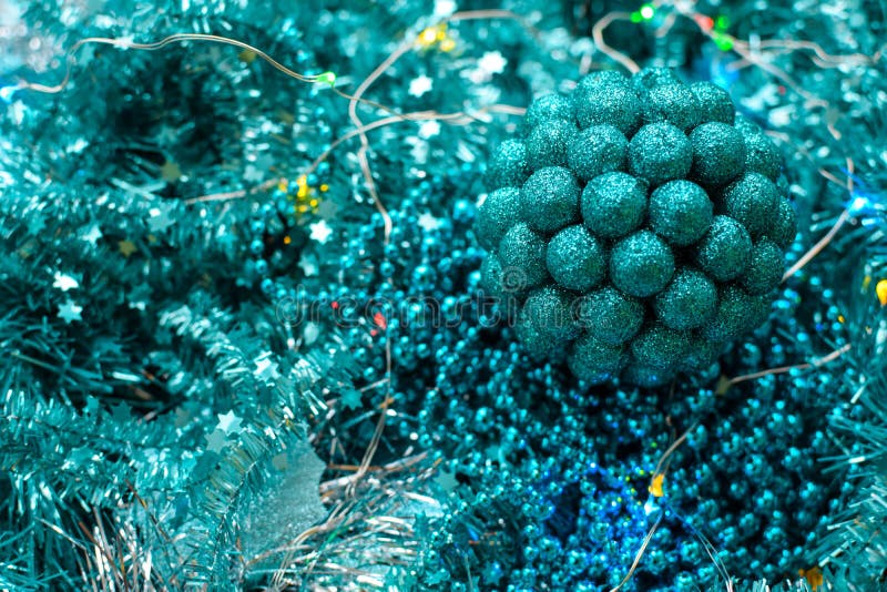 New Year or Christmas decorations of turquoise color: tinsel, balls, garlands