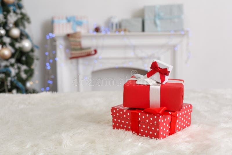 Decorated for new year room no people gift boxes stack close-up burred background. Decorated for new year room no people gift boxes stack close-up burred background