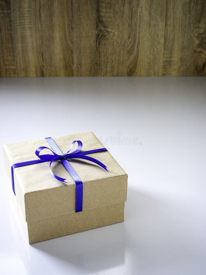 New Year Gift Box Made of Ribbon Tied with Blue Ribbon Stock Photo