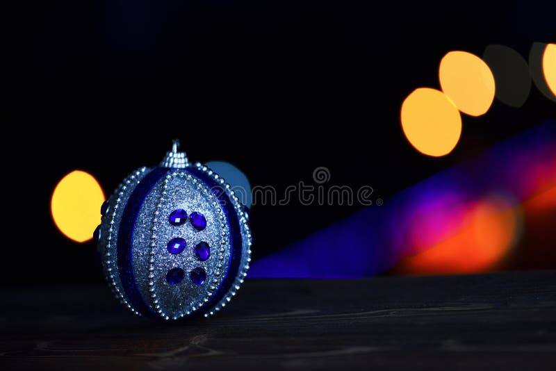 New year holiday xmas decorative colorful toy or ball with defocused bokeh light on colorful background, copy spac royalty free stock images