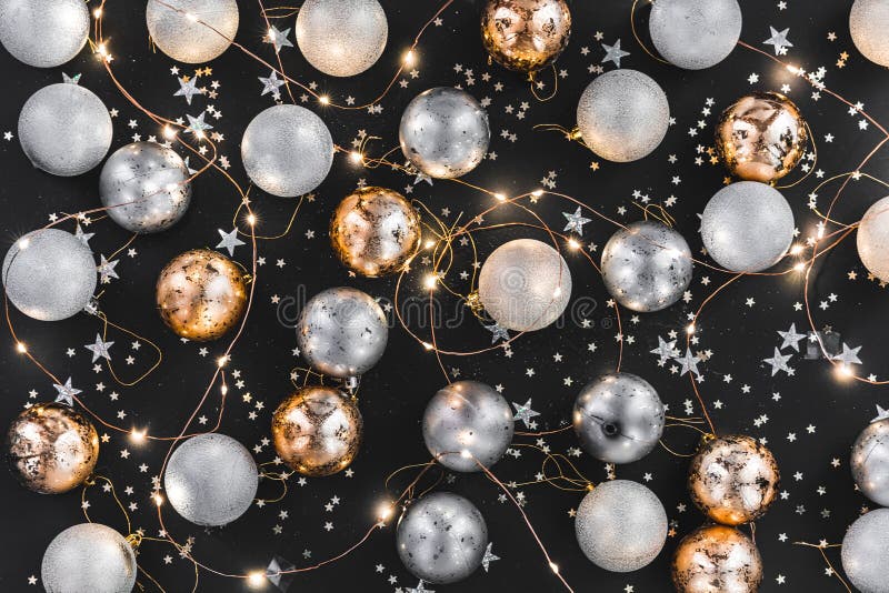 New year 2020. Merry Christmas and Happy Holidays greeting card. Christmas composition. Gold and silver decorations on black stock photography New year 2020. Merry Christmas and Happy Holidays greeting card. Christmas composition. Gold and silver decorations on black stock photography