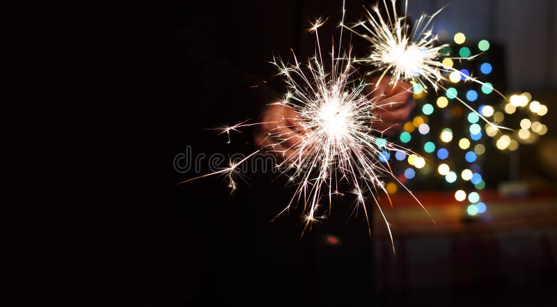 New Year`s Eve, Bengal lights, colorful bokeh, hands, man, New Y. New Year, New Year`s Eve. Bengal lights in the hands of a man, colorful bokeh royalty free stock image New Year`s Eve, Bengal lights, colorful bokeh, hands, man, New Y. New Year, New Year`s Eve. Bengal lights in the hands of a man, colorful bokeh royalty free stock image