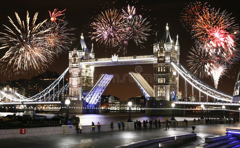 New Year`s Eve Fireworks over Tower Bridge, People Present, at night. New Year`s Eve Fireworks over Tower Bridge, People Present, at night.