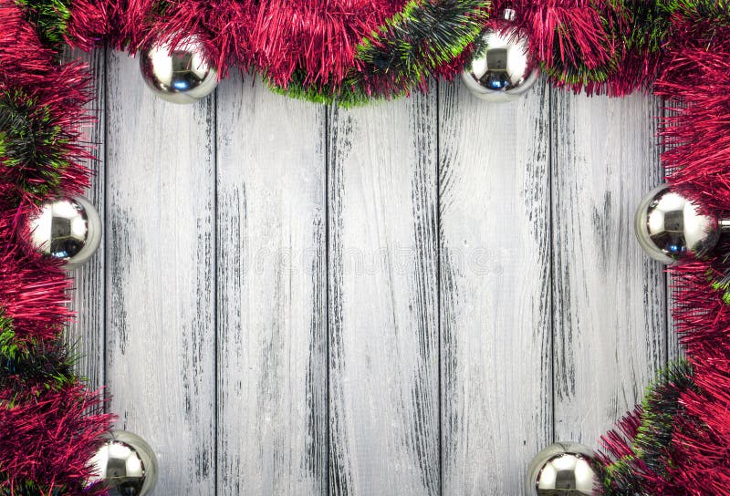 New year theme christmas tree red and green decoration and silver balls on white retro wood background