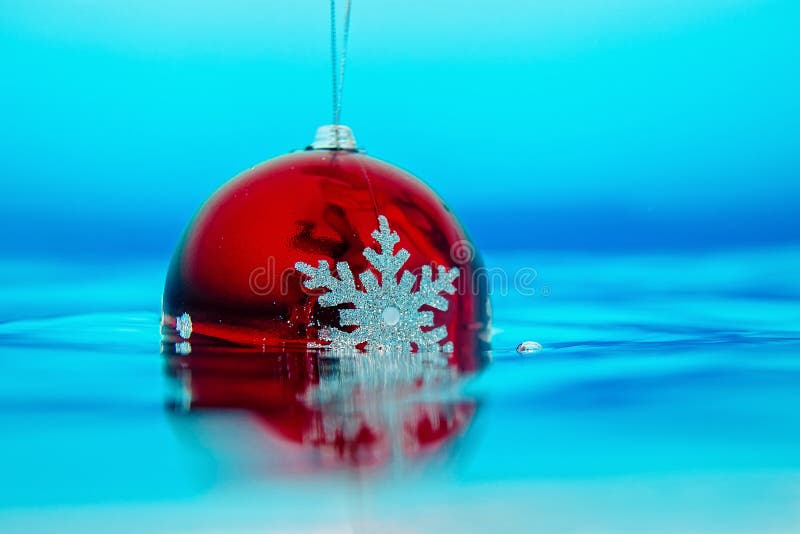 New year tree decoration flowing in the blue water