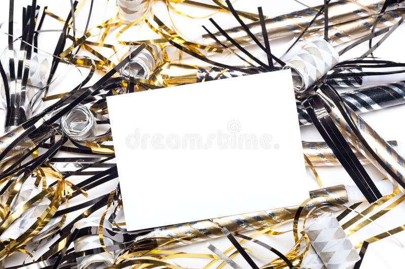 New Years party horns with blank invitation card. A blank party invitation with party blow horns and streamers. Card is blank for placement of copy stock image New Years party horns with blank invitation card. A blank party invitation with party blow horns and streamers. Card is blank for placement of copy stock image