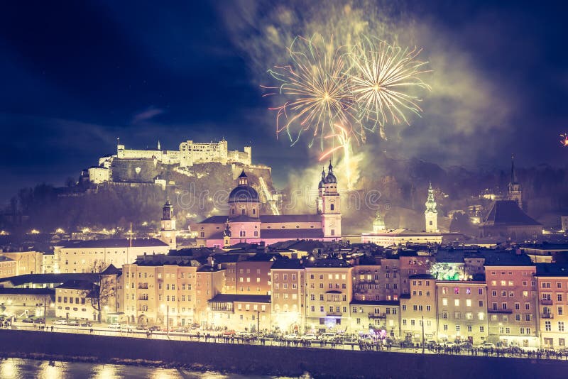 Colorful firework in the night: Old city of Salzburg and Festung Hohensalzburg at New Yearâ€™s Eve. Magic years austria celebration sylvester landscape idyllic romantic 2020 castle fortress 2021 panoramic flair architecture medieval 2022 mozart magical salzach river glamorous landmark europe turn holiday midnight party vacation tour tourism travel christmas buildings copy space trip fine dust pollution. Colorful firework in the night: Old city of Salzburg and Festung Hohensalzburg at New Yearâ€™s Eve. Magic years austria celebration sylvester landscape idyllic romantic 2020 castle fortress 2021 panoramic flair architecture medieval 2022 mozart magical salzach river glamorous landmark europe turn holiday midnight party vacation tour tourism travel christmas buildings copy space trip fine dust pollution