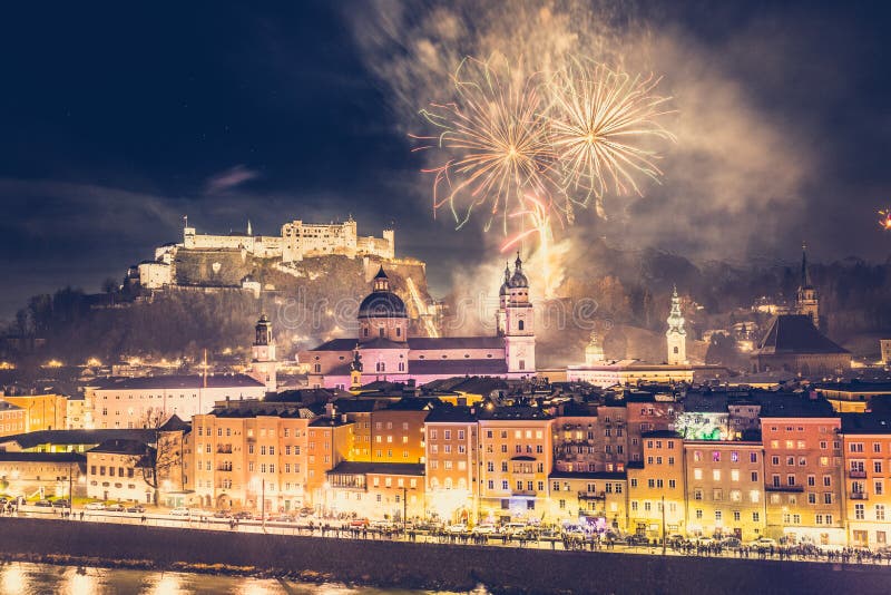 Colorful firework in the night: Old city of Salzburg and Festung Hohensalzburg at New Yearâ€™s Eve. Magic years austria celebration sylvester landscape idyllic romantic 2020 castle fortress 2021 panoramic flair architecture medieval 2022 mozart magical salzach river glamorous landmark europe turn holiday midnight party vacation tour tourism travel christmas buildings copy space trip fine dust pollution. Colorful firework in the night: Old city of Salzburg and Festung Hohensalzburg at New Yearâ€™s Eve. Magic years austria celebration sylvester landscape idyllic romantic 2020 castle fortress 2021 panoramic flair architecture medieval 2022 mozart magical salzach river glamorous landmark europe turn holiday midnight party vacation tour tourism travel christmas buildings copy space trip fine dust pollution