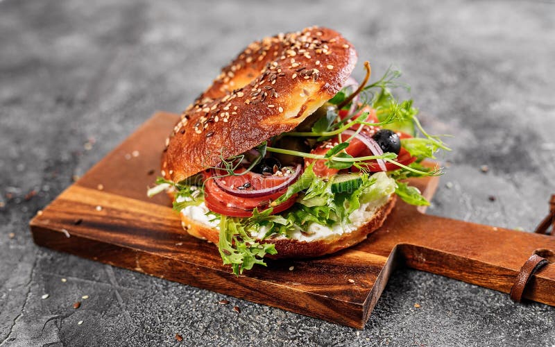 New York Bagel with Cream Cheese, Salad, Cucumber, Herbs, Olives and ...