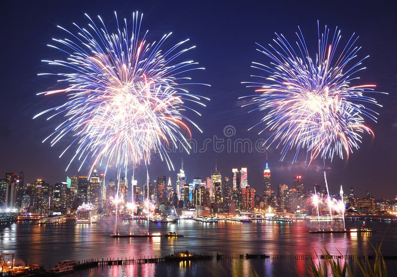 New York City Manhattan July 4th Independence day fireworks show with skyline over Hudson River viewed from New Jersey