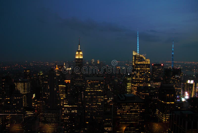 New York City Manhattan skyline panorama with Empire State Building and skyscrapers at night. New York City Manhattan skyline panorama with Empire State Building and skyscrapers at night