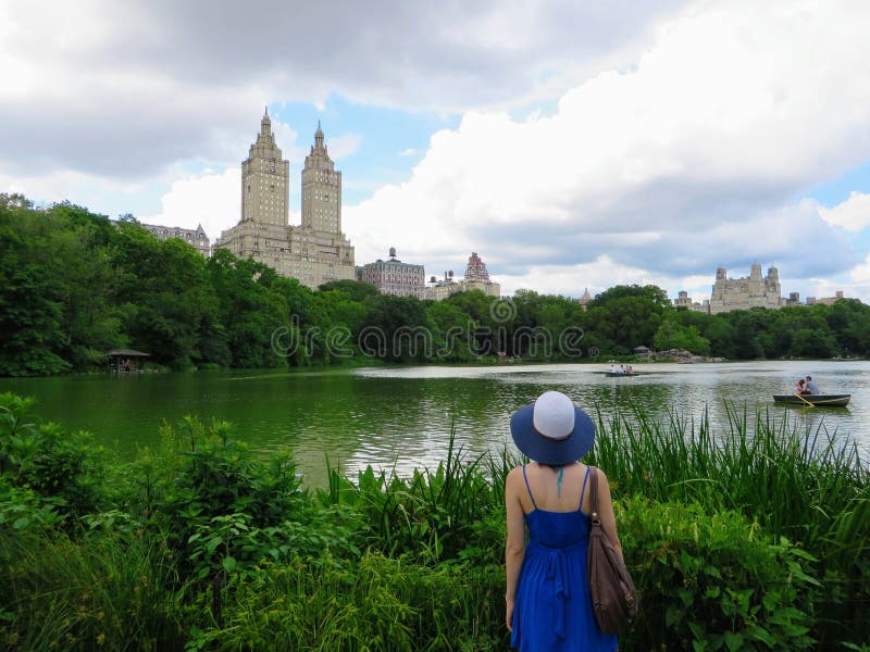 New York City, New York, United States - June 26th, 2014: A young well dressed tourist admires Central Park and the surrounding J royalty free stock image New York City, New York, United States - June 26th, 2014: A young well dressed tourist admires Central Park and the surrounding J royalty free stock image