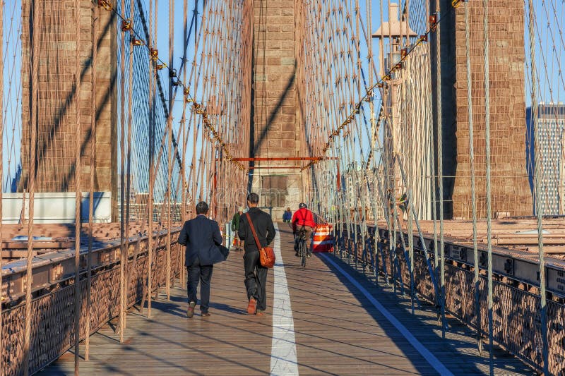 NEW YORK CITY - OCTOBER 26: The pedestrian walkway along The Brooklyn Bridge in New York City on October 26, 2013. Approximately 4,000 pedestrians and 3,100 cyclists cross this historic bridge each day