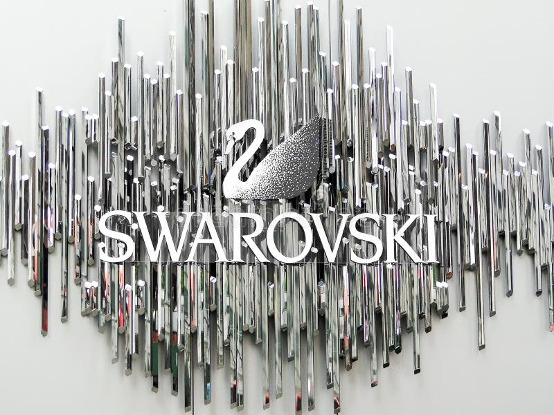 New York, June 1 2011: The Swarovski swan symbol and logo on a wall. New York, June 1 2011: The Swarovski swan symbol and logo on a wall.