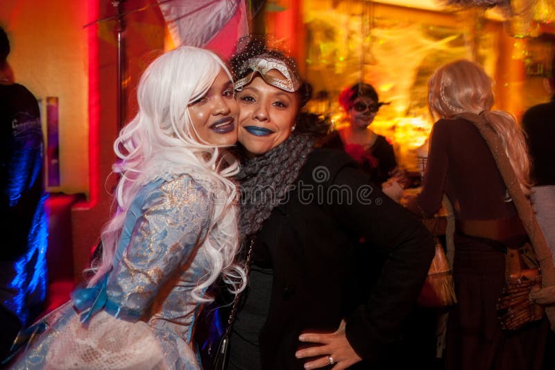 NEW YORK, NY - OCTOBER 31: Guests in mascaraed costumes posing at The Fashion Party during Halloween event