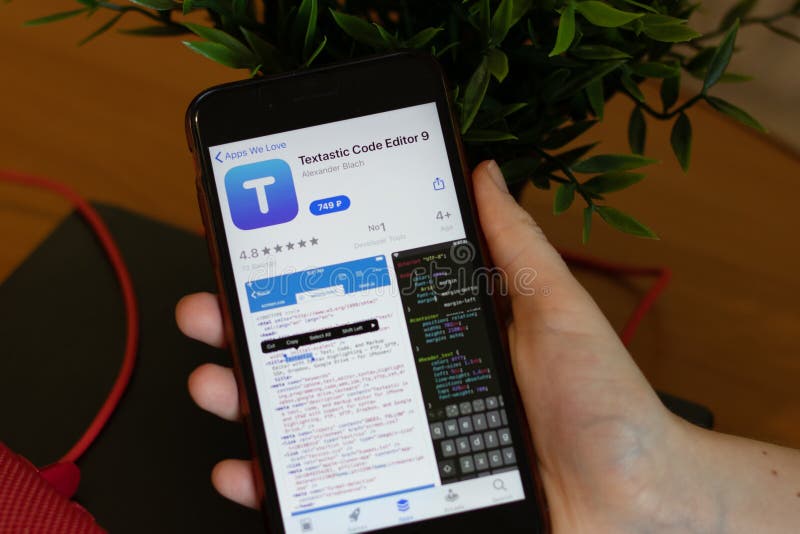 New York, USA - 1 May 2020: Textastic Code Editor 9 app icon logo on mobile phone screen close-up, Illustrative Editorial stock photos