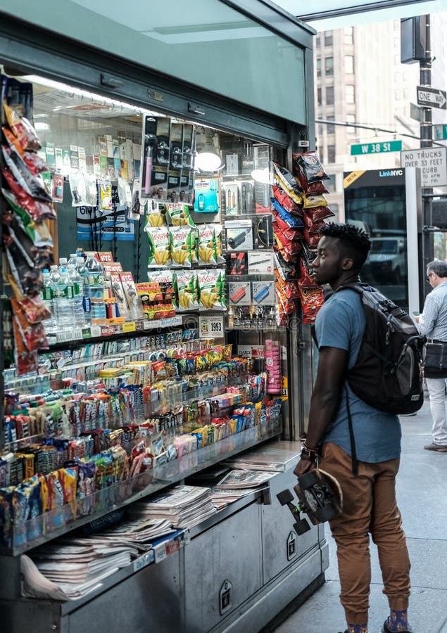 New Yorker seen waiting to be served by a mobile tobacconist in central New York, near Times Square.