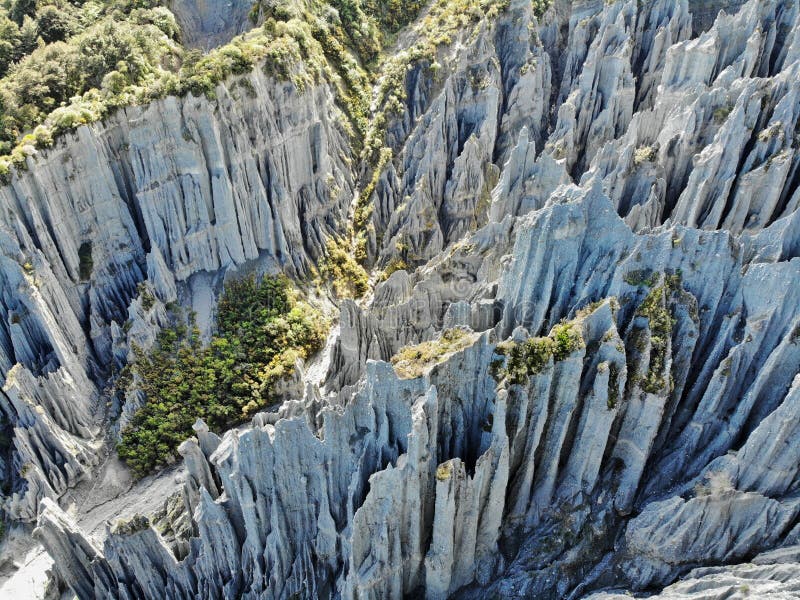 New Zealand, Putangirua Pinnacles are a geological formation and one of the New Zealand`s best examples of badlands erosion. This place is famous because of the eerie scenes in The Return of the King Lord of the Rings as Aragorn, Legolas and Gimli ride along the Dimholt Road to meet the Army of the Dead which were filmed against the surreal backdrop of the Pinnacles. New Zealand, Putangirua Pinnacles are a geological formation and one of the New Zealand`s best examples of badlands erosion. This place is famous because of the eerie scenes in The Return of the King Lord of the Rings as Aragorn, Legolas and Gimli ride along the Dimholt Road to meet the Army of the Dead which were filmed against the surreal backdrop of the Pinnacles.