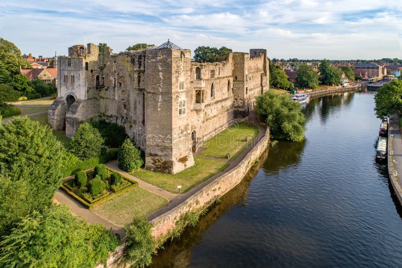 Medieval Gothic castle in Newark on Trent, near Nottingham, Nottinghamshire, England, UK. Aerial view with Trent River in sunset light. Medieval Gothic castle in Newark on Trent, near Nottingham, Nottinghamshire, England, UK. Aerial view with Trent River in sunset light