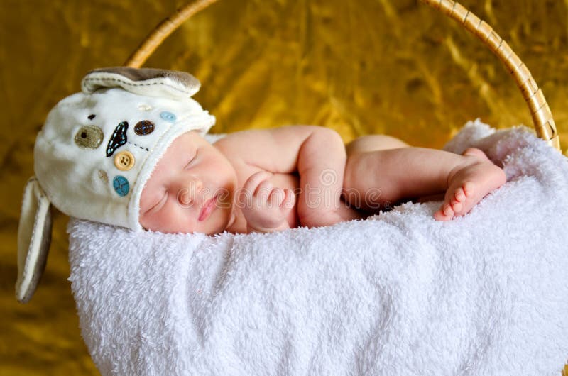 Newborn baby in a basket stock image. Image of girl, female 75958719