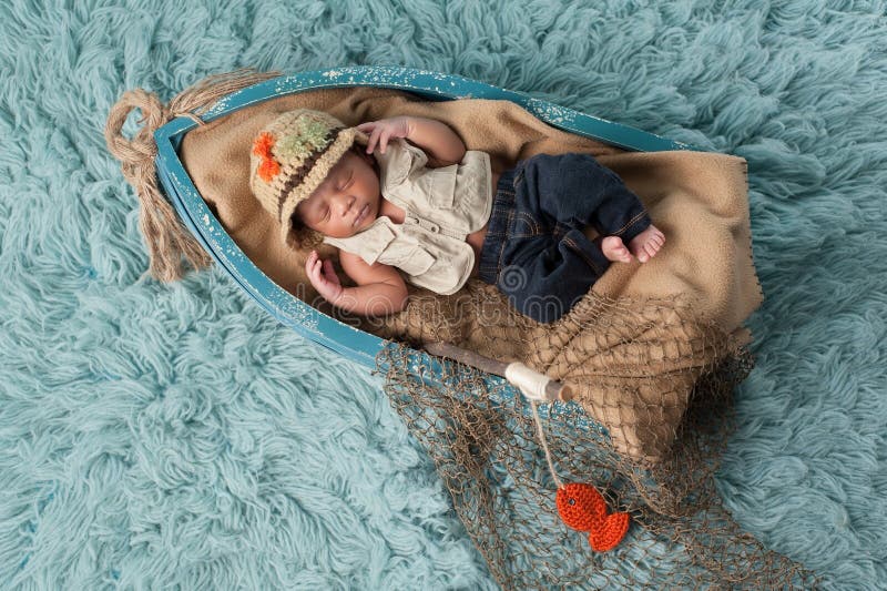 https://thumbs.dreamstime.com/b/newborn-baby-boy-fisherman-outfit-portrait-two-week-old-sleeping-miniature-boat-wearing-s-hat-vest-jeans-64945119.jpg