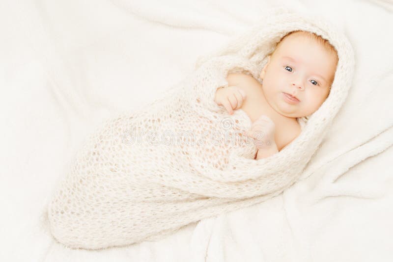 Newborn Baby Covering Soft Woolen Blanket, White Background Stock Image