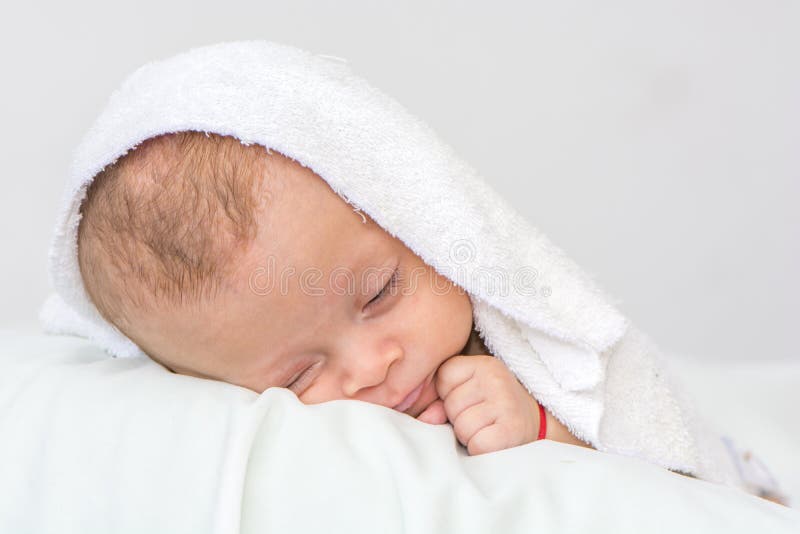 Newborn Baby Curled Up Sleeping on a Blanket Stock Photo Image of