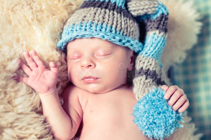 Newborn Baby in a Funny Hat. Stock Photo Image of emotions, child