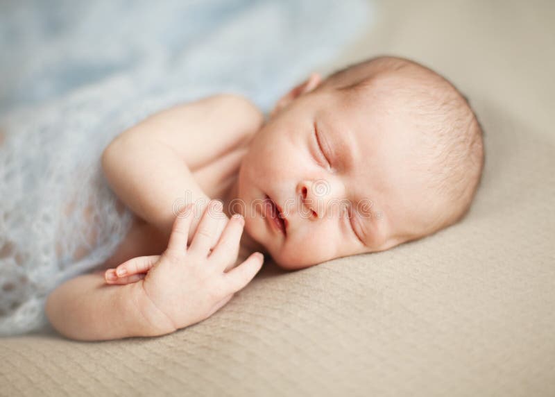Newborn Baby Girl Asleep on a Blanket. Stock Photo Image of female