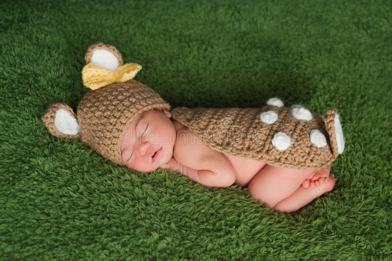 Newborn Baby Girl in Fawn / Deer Costume royalty free stock images Newborn Baby Girl in Fawn / Deer Costume royalty free stock images
