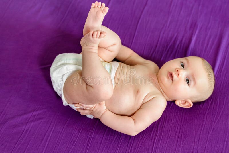 newborn-baby-girl-in-green-potato-sack-pose.jpg | Studio 708 Oshkosh  Photography