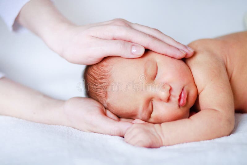 Newborn baby in mother s hand