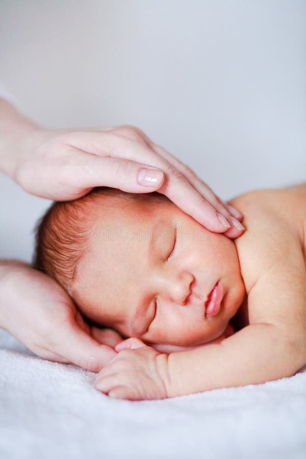 Newborn baby in mother s hand