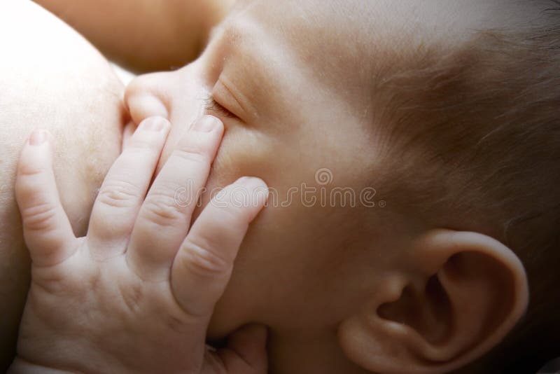 Newborn baby near breast