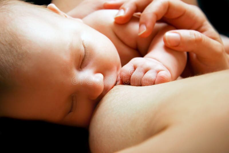 Newborn baby near breast