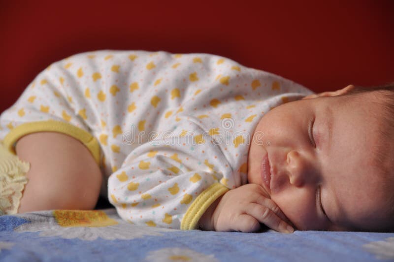 Newborn baby girl sleeping stock image. Image of side 13399025