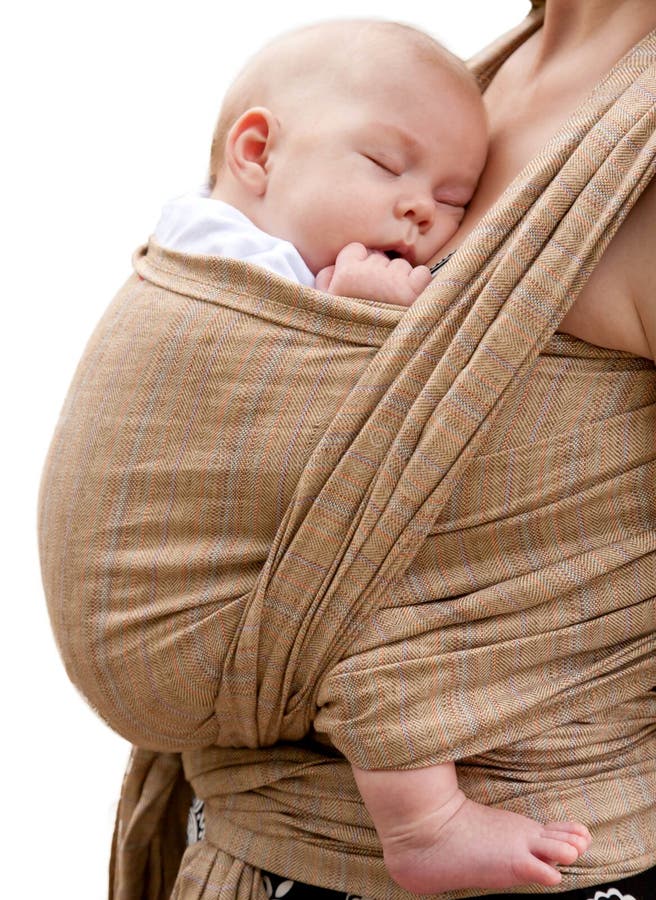 Best deep sleep. Newborn baby sleeping in a sling, in the embrace of her mother isolated on a white background