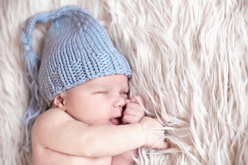 Newborn baby sleeping on white background